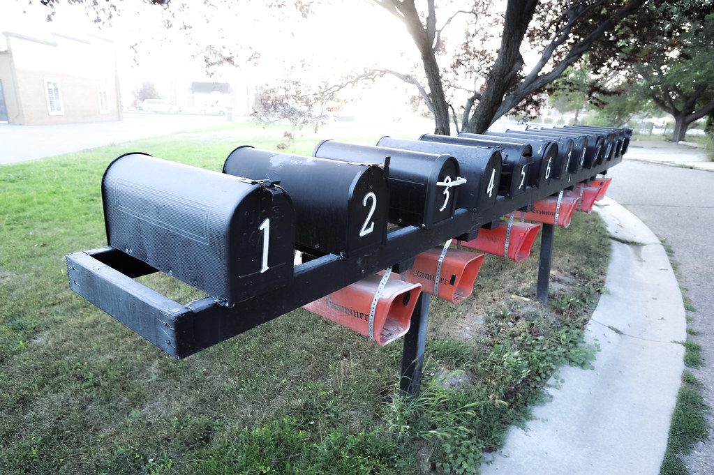 Rows of metal mailboxes of the kind renewal notices arrive in